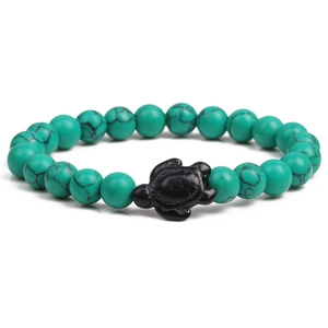Detailed view of ocean turquoise beads and black matte turtle charm on elastic bracelet