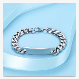 Detail of silver stainless steel 11MM Cuban link bracelet with blank ID plate on blue ribbon
