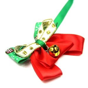 Christmas pet bowtie with gold bell and green snowflake patterns on red satin ribbon