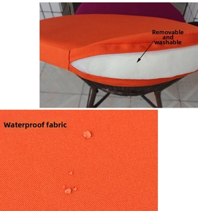 Detail of round orange waterproof outdoor chair cushion with removable cover and zipper