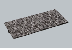 Detail of durable black canvas pencil wrap with white leaf and berry plant patterns