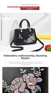 Dettaglio del ricamo floreale complesso su una borsa a mano in pelle nera chic
