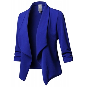 Detail of royal blue slim-fit blazer showing crepe fabric texture and ruched sleeves