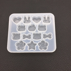 Macro detail of multi-shape silicone resin mold with heart, rabbit, and star cavities
