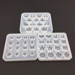 Detail view of translucent silicone molds featuring various shapes for DIY epoxy resin craft