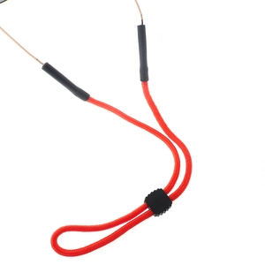 Detail of orange nylon sports eyewear lanyard with adjustable black slider and rubber ends