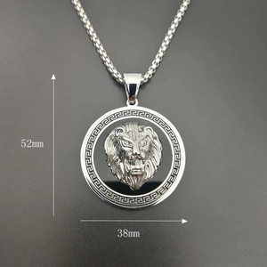 Detail view of 52mm x 38mm gold lion head pendant with greek key border dimensions