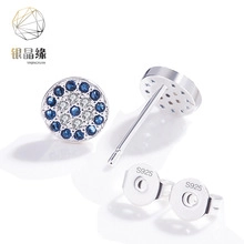 Macro detail of S925 sterling silver stamp on blue and white zircon stud earrings