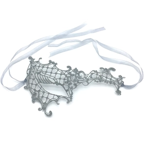 Detail of silver lace masquerade mask with intricate vine patterns and ribbon ties