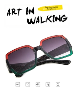 Detail of square frame sunglasses with red black green glitter finish and HD gradient lenses