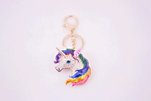 Detailed close-up of a colorful enamel unicorn keychain with sparkling crystal rhinestones