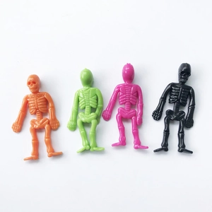Set of four colorful TPR soft rubber skeleton toys in orange, green, pink, and black colors