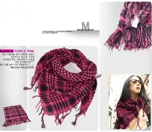 Detail of pink and black houndstooth pattern and fringe tassels on tactical square scarf