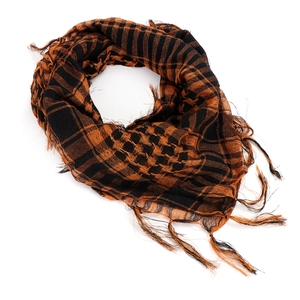 Detail of orange and black tactical shemagh scarf with fringes and woven patterns