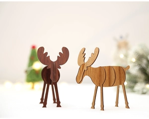 Close-up of DIY wooden reindeer desk ornaments in dark and light brown wood grain finish