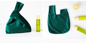 Detail of dark green velvet knot bag showing both tied handle and flat layout views