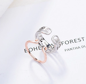 Detailed close-up of S925 sterling silver monkey king crown rings in silver and rose gold