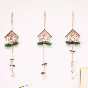 Detailed view of three hanging wooden Christmas house ornaments with miniature figurines