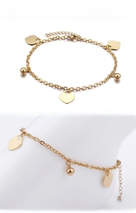 Golden heart charm anklet with polished discs and small metal beads on delicate chain