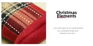 Close-up of red plaid Christmas fabric with green and white weave and velvet piping