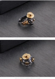Macro detail of gothic joker pirate ring in silver and gold plated steel finish
