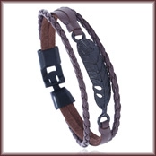 Detail of woven brown leather bracelet featuring black feather pendant and clasp