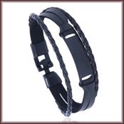 Close-up of a multilayer black leather woven bracelet with a rectangular metal plate