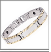 Detail of gold and silver magnetic health bracelet with embedded magnets and buckle