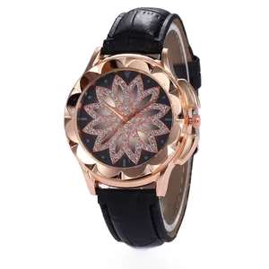 Detail of rose gold flower-shaped bezel and black dial with rhinestone floral pattern