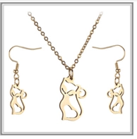 Detailed view of the gold cat-shaped jewelry set featuring hollow heart silhouettes