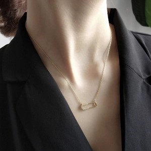 925 silver safety pin necklace with sparkling zircons on a gold-plated chain