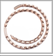Detail of rose gold H-link double chain necklace with micro-pave rhinestone rectangular clasp