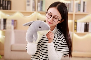 Close-up of soft shark hand puppet showing gray and white plush texture for storytelling