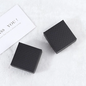 Elegant black diamond texture jewelry boxes for rings and necklaces on soft white plush