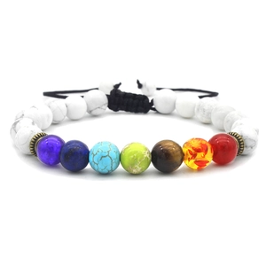 Detailed shot of 7 Chakra beads and white Howlite stones on an adjustable braided bracelet