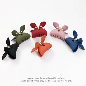 Set of matte bow hair clips in black, green, wine red, pink, orange, and blue colors