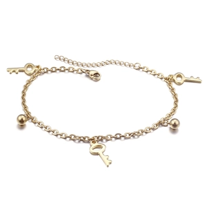 Gold-tone key and bead anklet chain with secure lobster clasp on white background