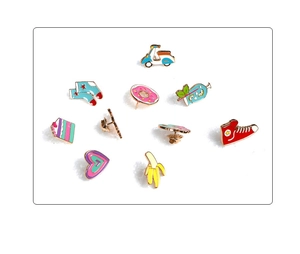 Set of 10 colorful enamel pins with fun shapes like donuts and shoes on white backdrop