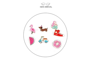 Detail view of 7 pieces enamel pins set featuring flamingo and mermaid designs