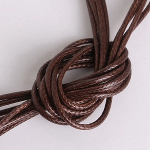 Deep brown 2mm waxed cord for DIY necklaces, showing detailed braided texture and knotting