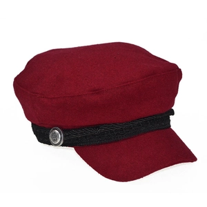 Close-up of a burgundy wool newsboy cap featuring a silver crown button and braided strap