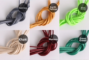 Macro detail of 2mm waxed cord strands in diverse colors for DIY jewelry making