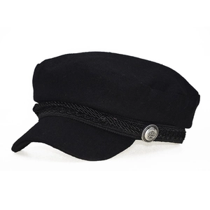 Detail of wool newsboy cap featuring braided rope and silver crown metal button