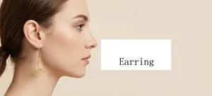 Detail of twisted 18k gold plated stainless steel C-hoop earrings worn by a model
