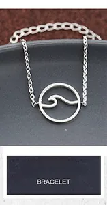 Detail view of wavy circular pendant bracelet with silver link chain and adjustable clasp