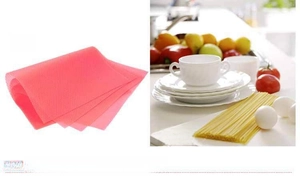 Detailed view of pink silicone kitchen mat with non-slip honeycomb texture for drawers