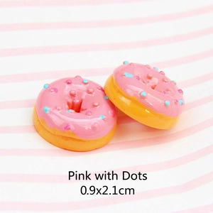Macro detail of 0.9x2.1cm pink resin doughnut accessory for DIY hair clips and jewelry