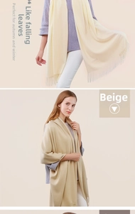 Detail of soft beige cashmere wool scarf with elegant tassel edges and cozy texture