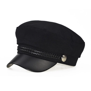 Detail of black newsboy hat with braided rope trim and vintage embossed metal buttons