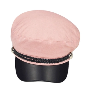 Detailed view of a pink newsboy cap with black leather brim and silver metal side buttons